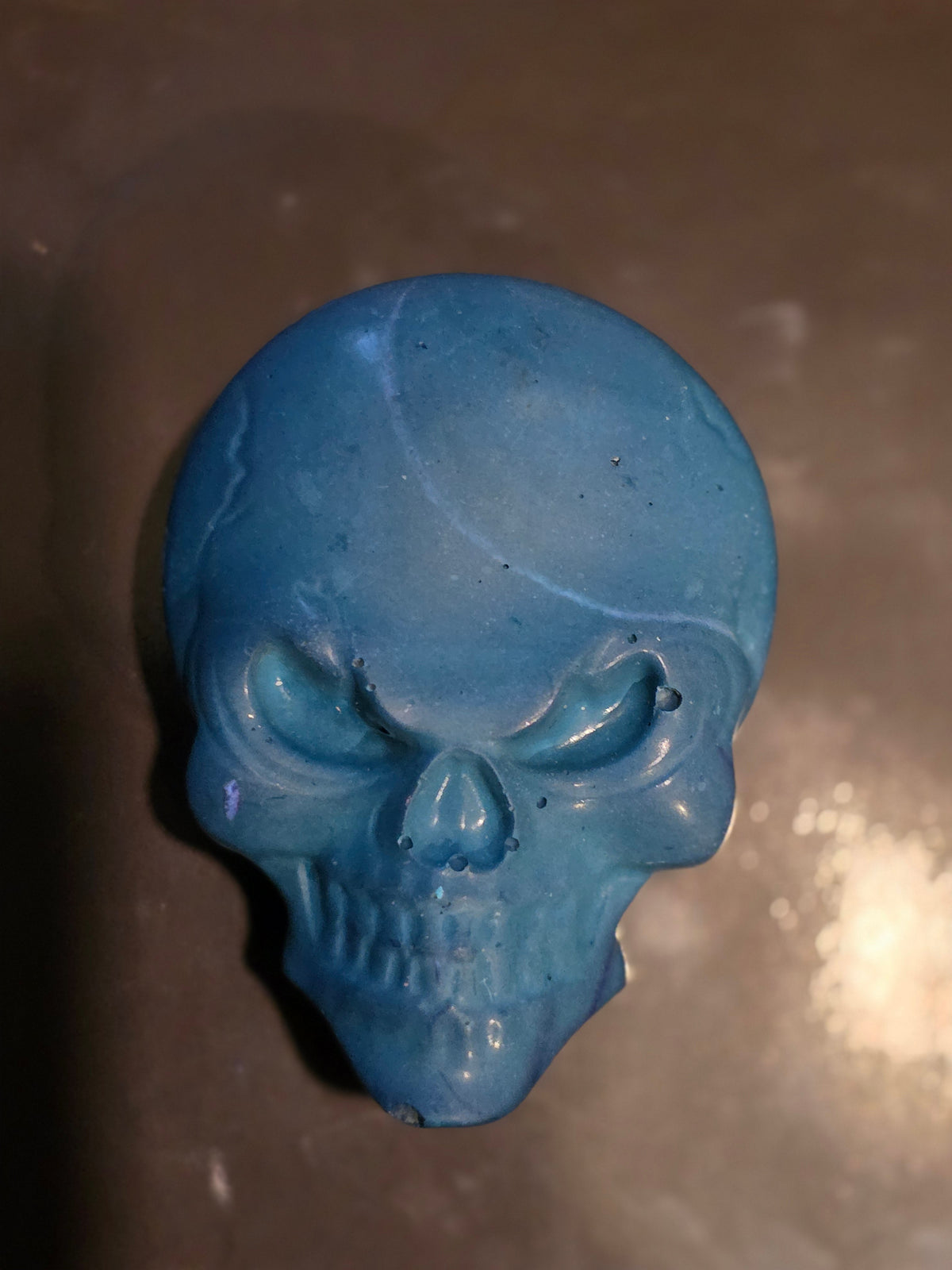 Blue skull magnet with a swipe of light blue